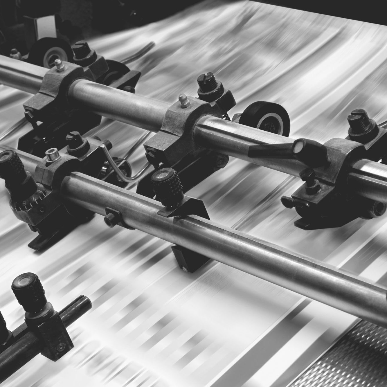 Printing and finishing machine printing sheets black and white